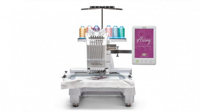Baby Lock Array embroidery machine with spools of thread and a tablet displaying software on a white background