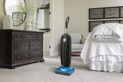 Riccar Cordless SupraLite R10CV.10 in a bedroom