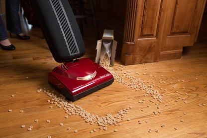 Riccar SupraLite R10P.2 Premium cleaning debris from a hardwood floor