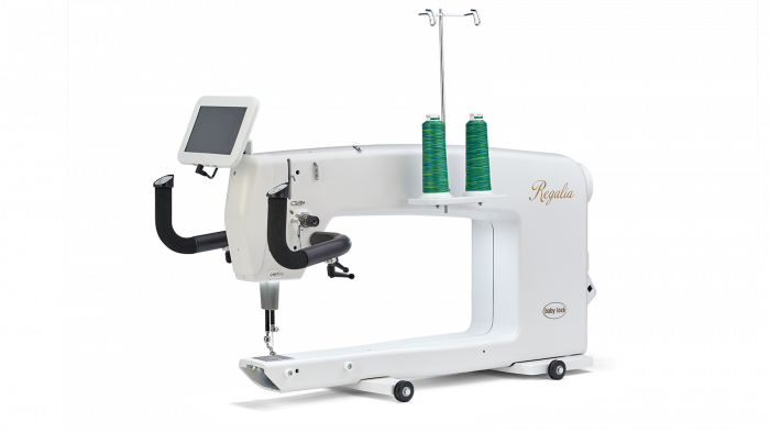 Baby Lock Regalia longarm quilting machine featuring green thread spools