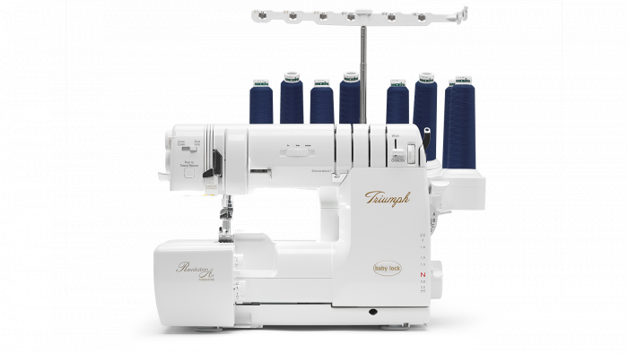 Baby Lock Triumph white sewing machine with multiple spools of thread on a white background