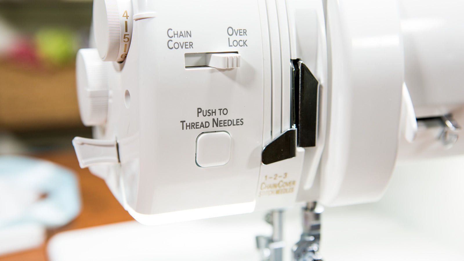 Baby Lock Triumph sewing machine close-up showing push button controls